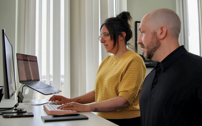 OuterBox Magento SEO services team reviewing technical crawl and indexation issues at a workstation
